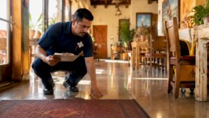 Janitorial supervisor inspecting clean office lobby