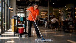 Cleaner mopping retail store floor