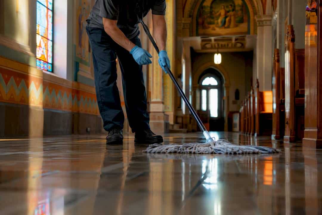Janitor mopping church hallway floor
