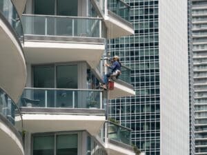 high rise window cleaner on skyscraper rope