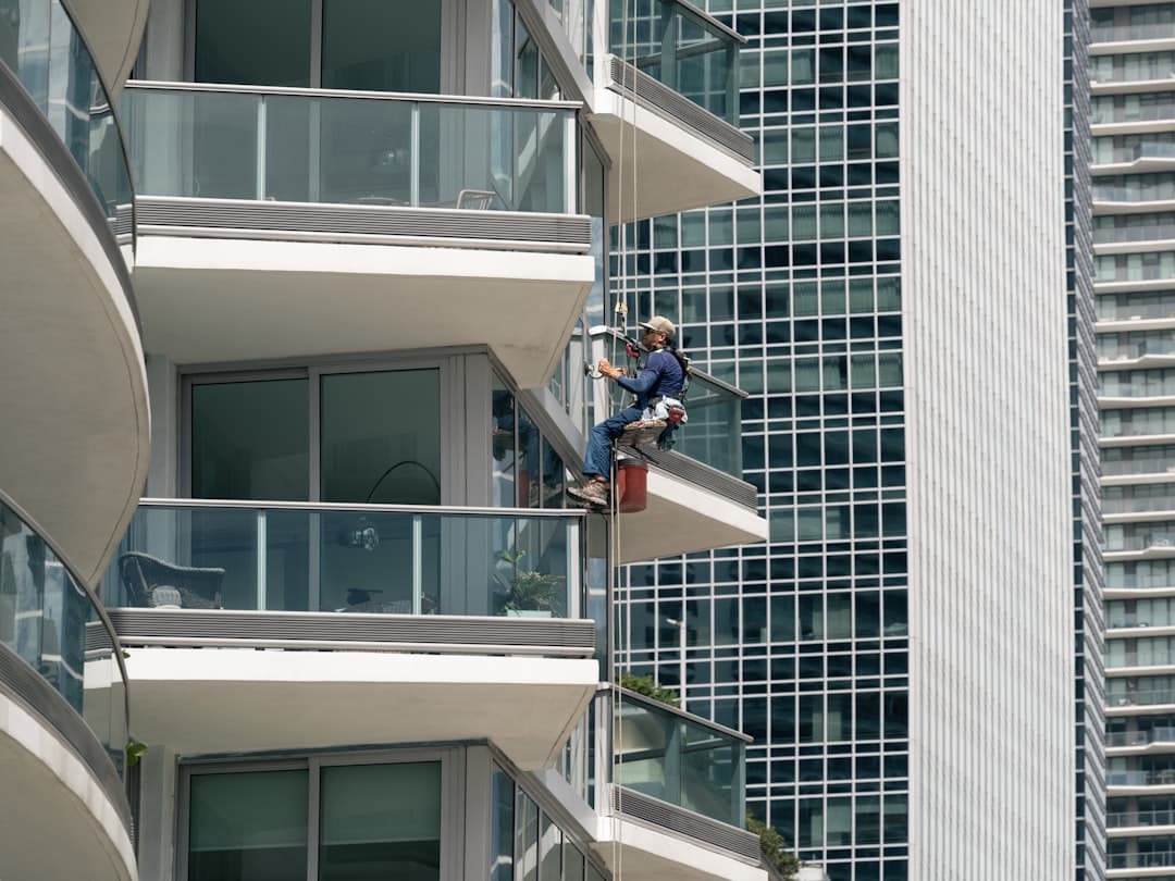 high rise window cleaner on skyscraper rope