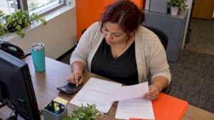 Office manager comparing cleaning bid estimates