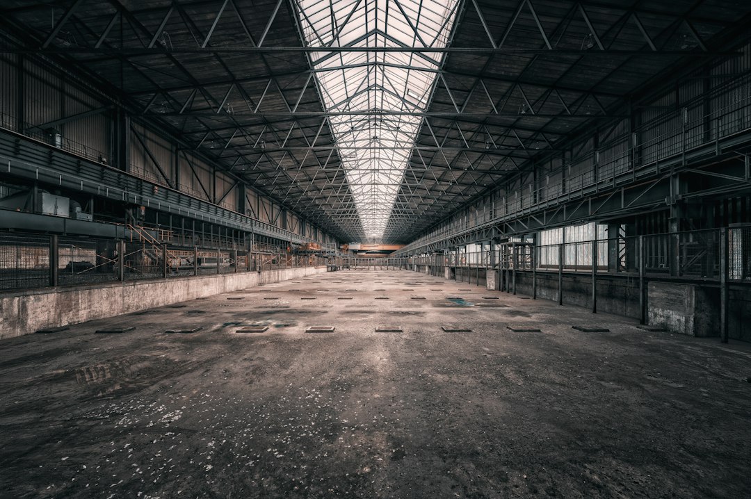 industrial warehouse concrete slab maintenance with ride-on scrubber